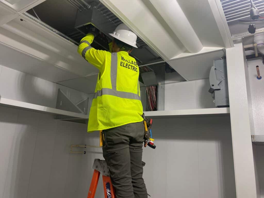 Technician performing Timely Break/Fix Repairs in a North Logan - UT unit by replacing worn hinges