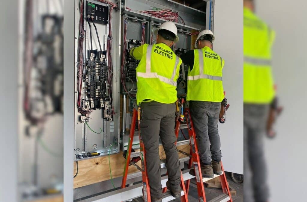 Kelso Building Services professionals coordinating project quotes and execution with detailed planning and system oversight.